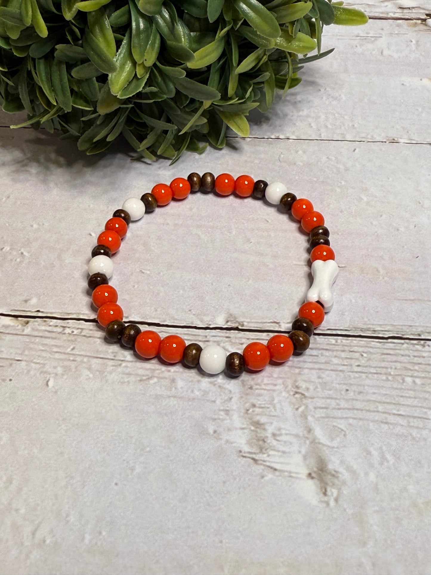 Bone with Orange and Brown Beads