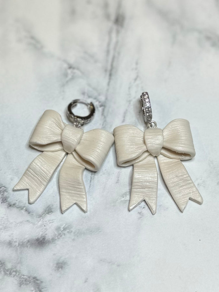 White Textured Bow With Silver Rhinestone Huggies