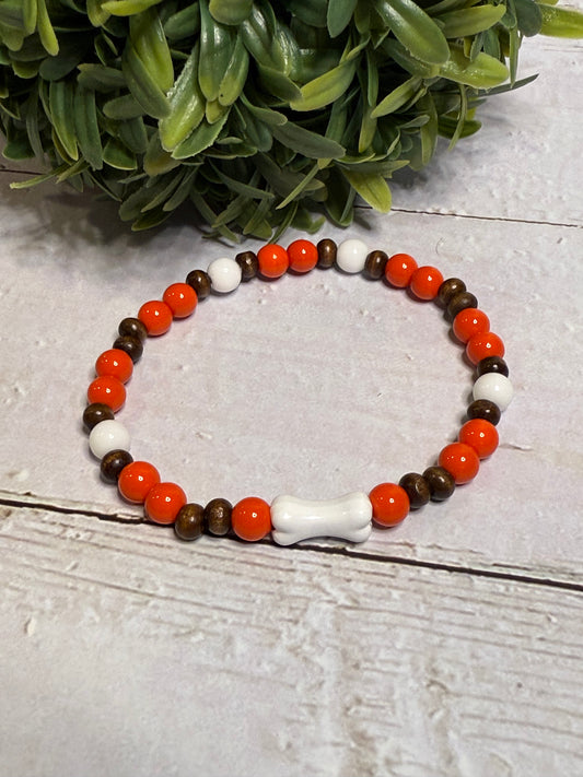 Bone with Orange and Brown Beads