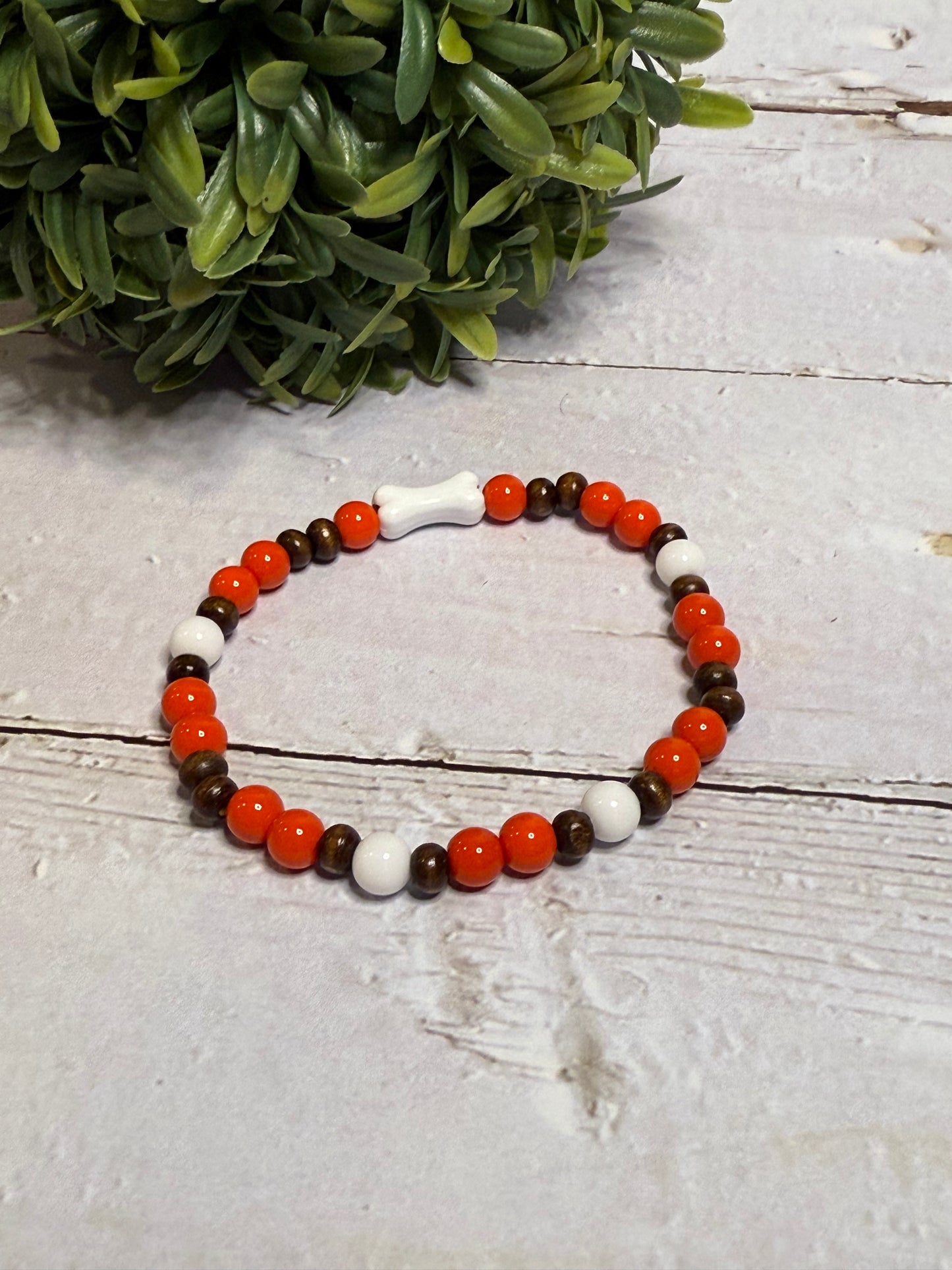 Bone with Orange and Brown Beads