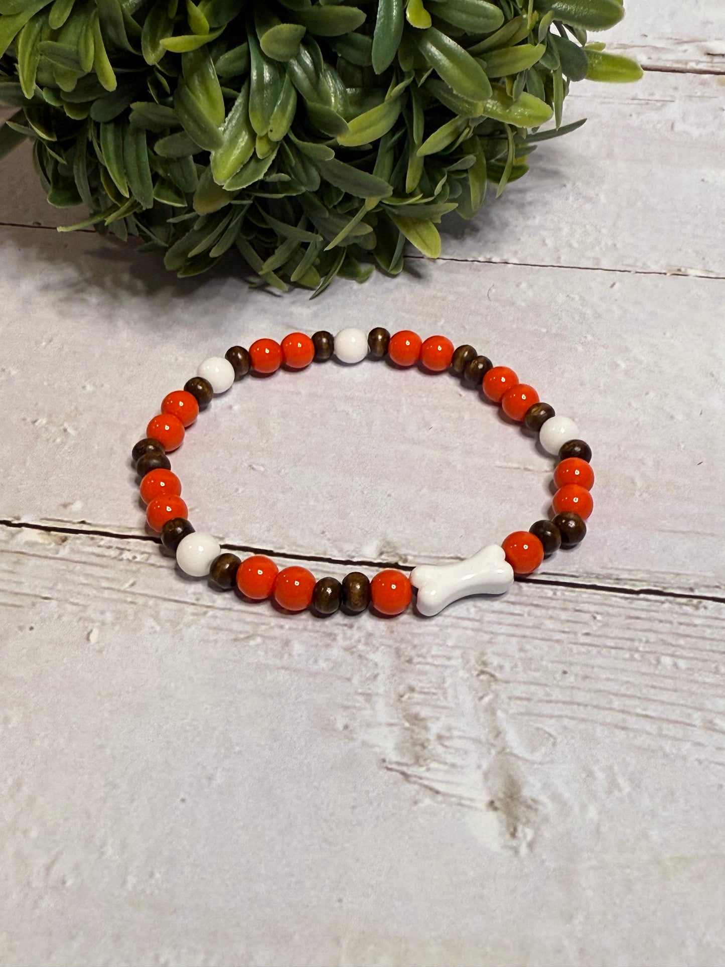 Bone with Orange and Brown Beads